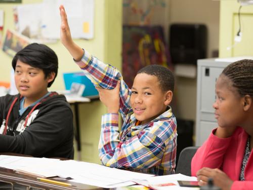 student raising hand