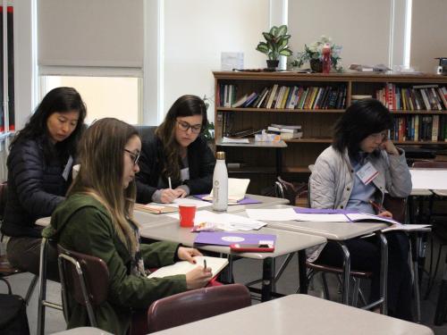 Teachers taking notes